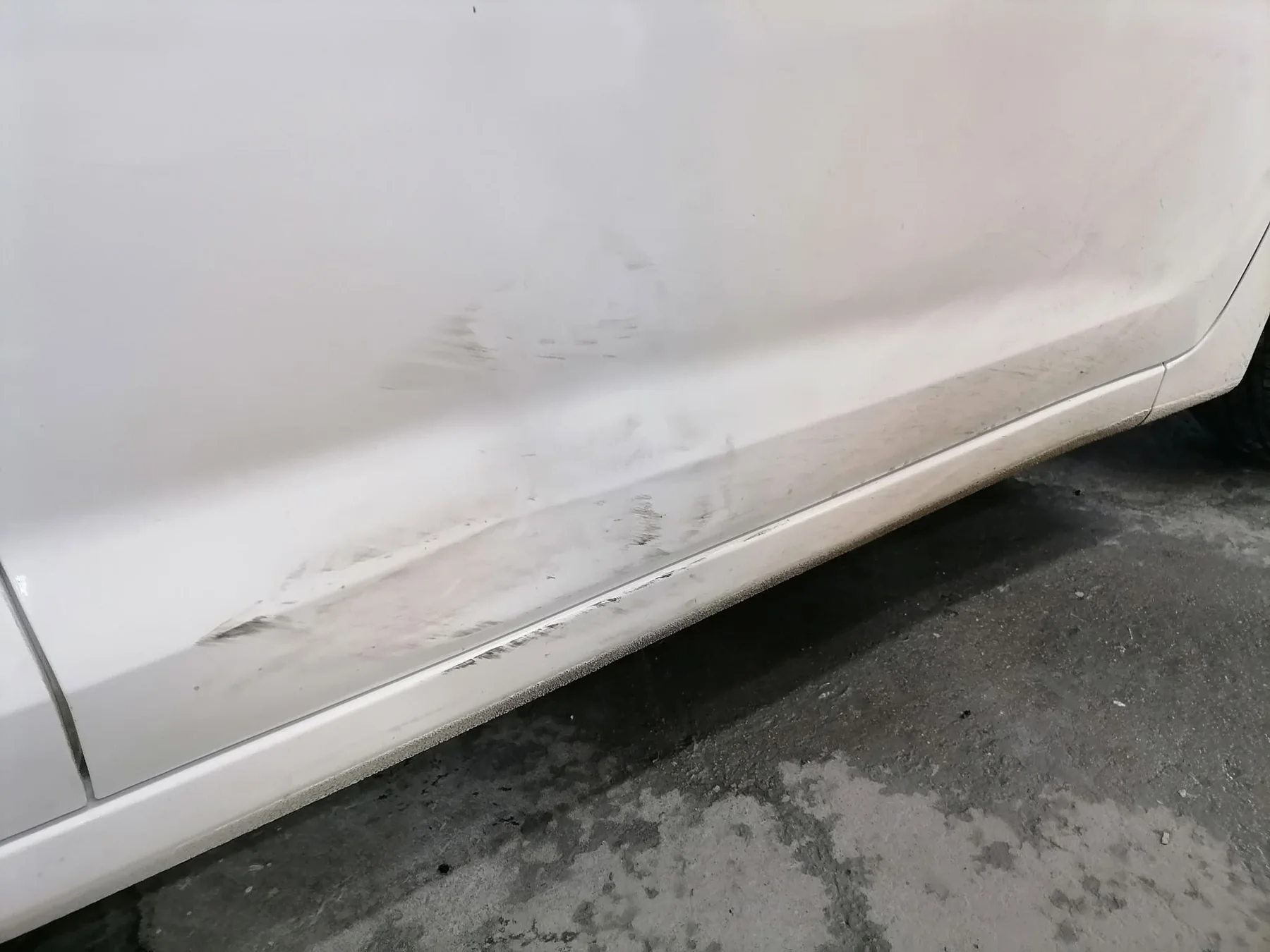 Vehicle panel before scratch repair