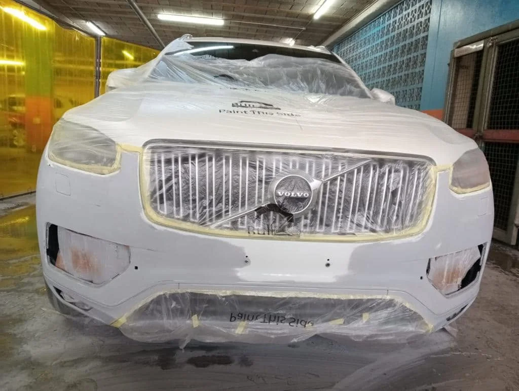 Volvo SUV during front paint preparation