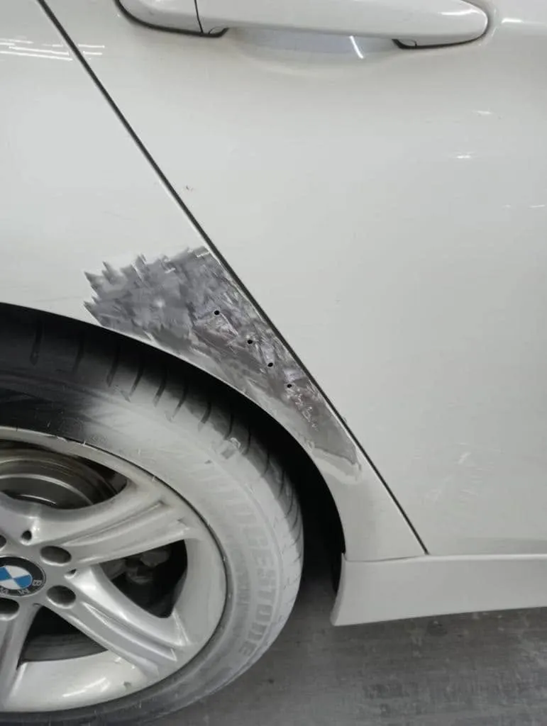 White BMW before repair